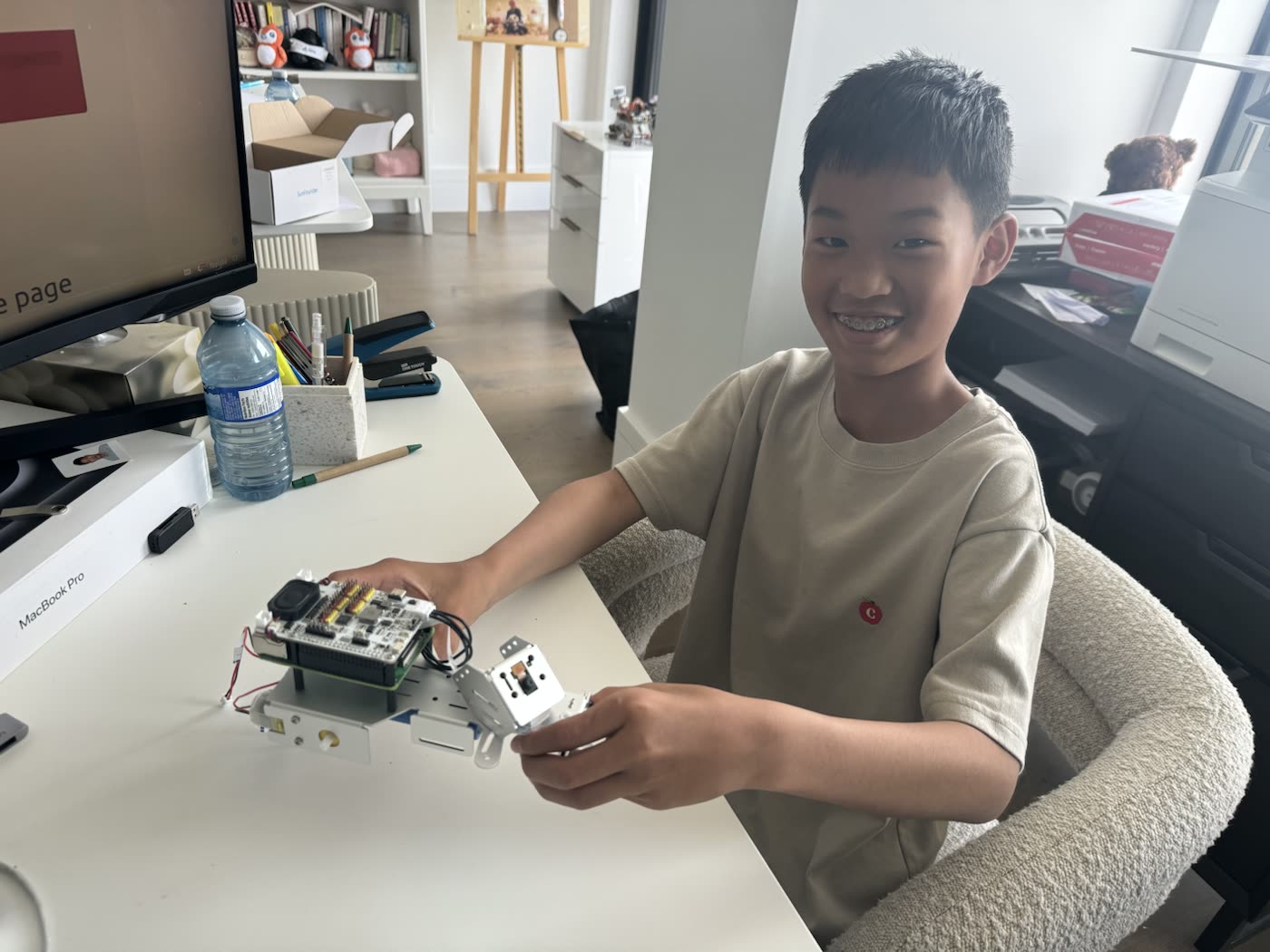Edwin holding his completed smart car